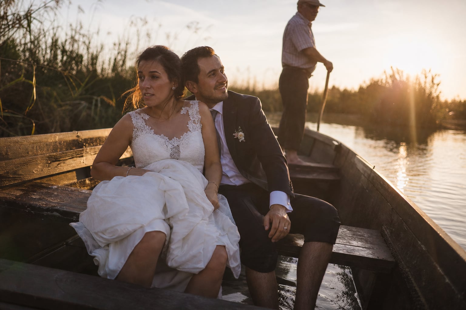 Couple in a wooden boat on the Albufera lagoon near Valencia at sunset